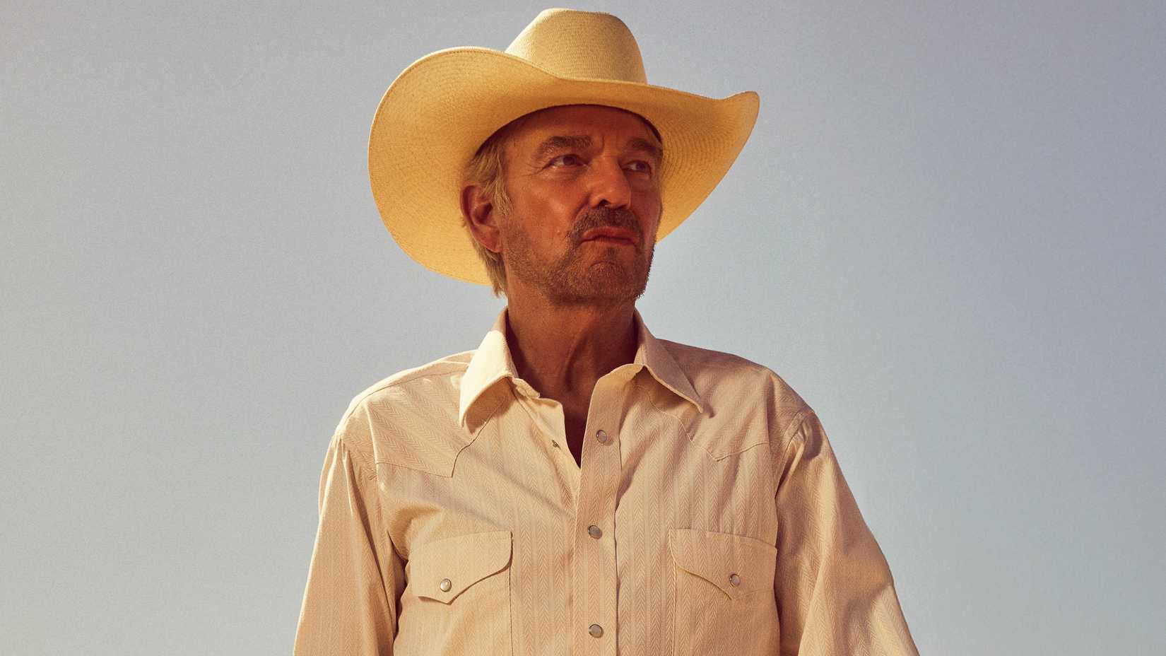 Tommy Norris, looking to the side, in a still from Landman