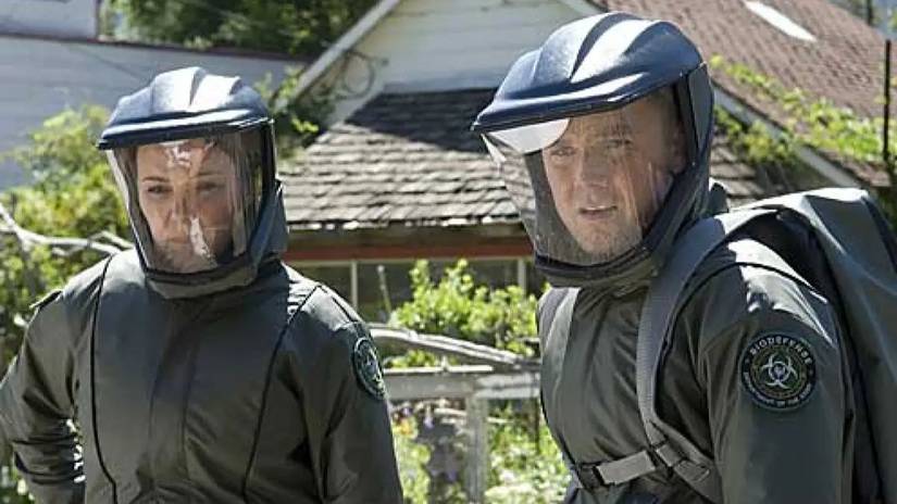 Two characters in protective suits ina. neighborhood in The Andromeda Strain.