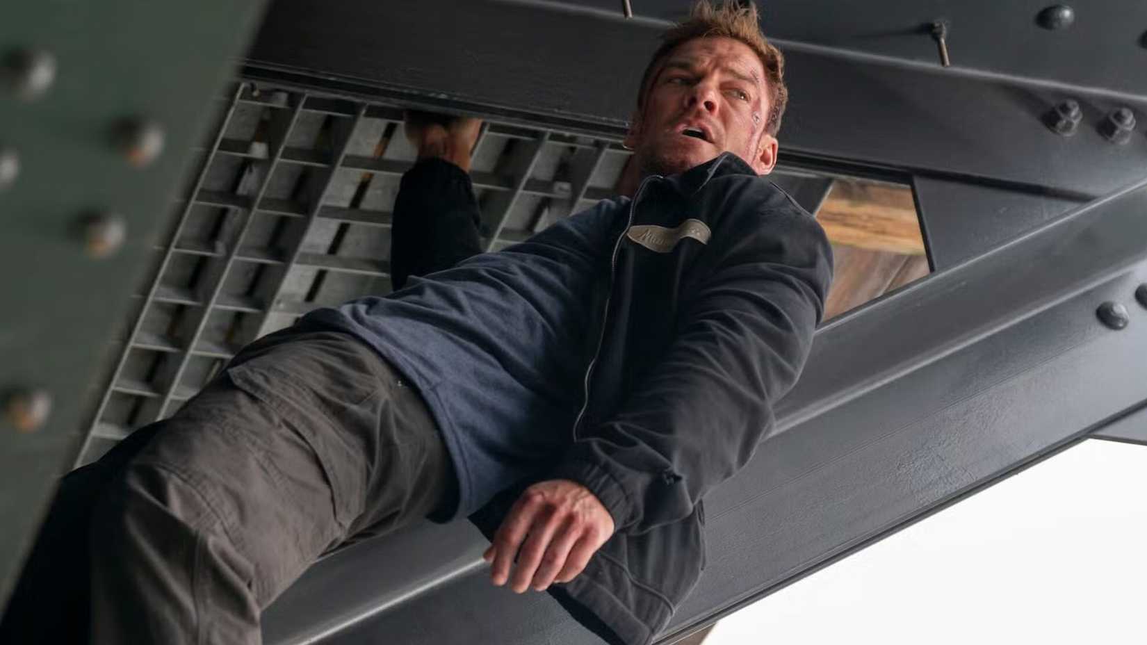 Jack Reacher climbing a metal structure