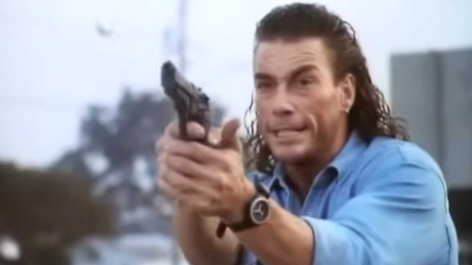 Van Damme as Chance firing a pistol in hard target