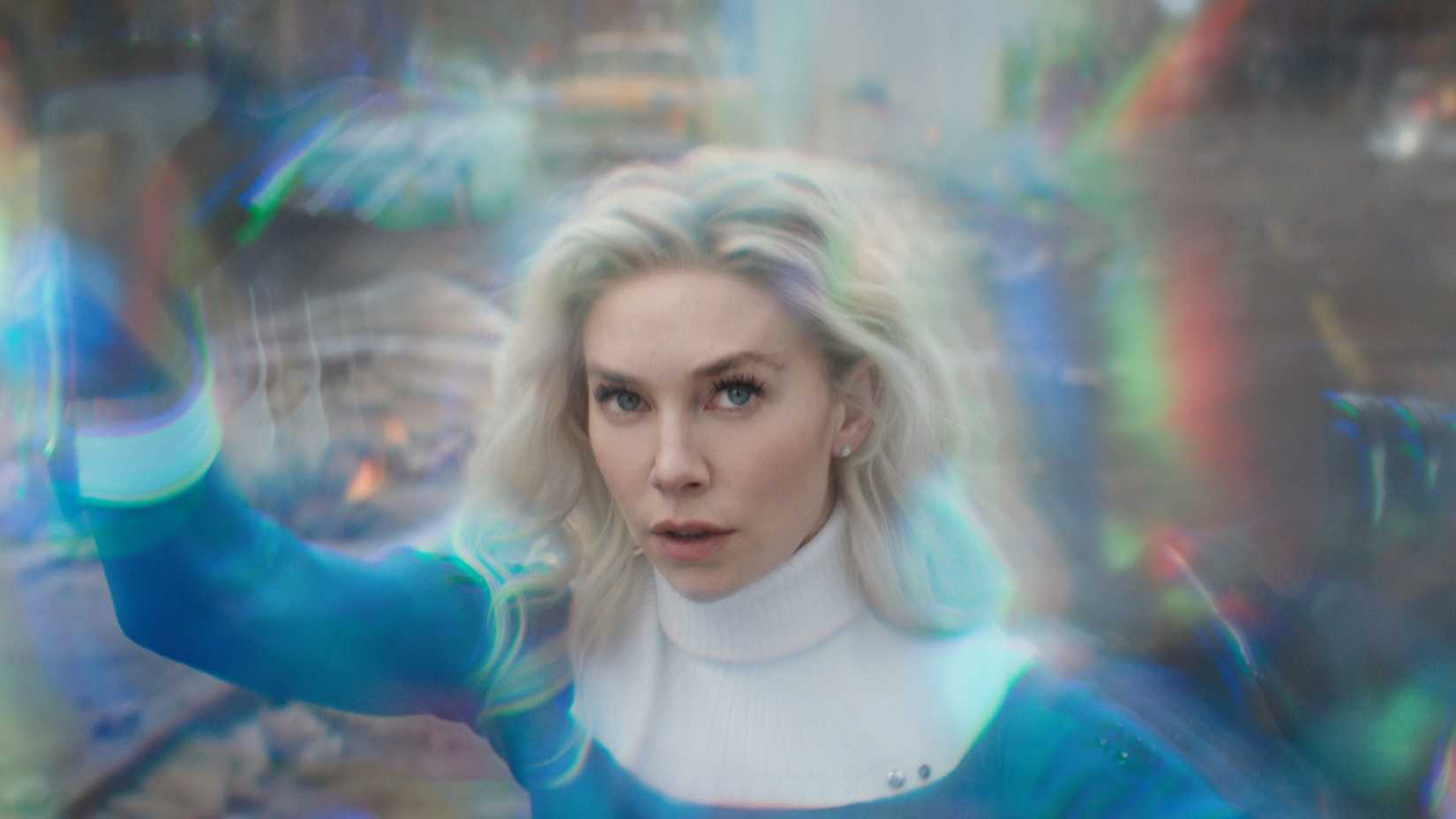 Invisible Woman generating a force field in a damaged city street