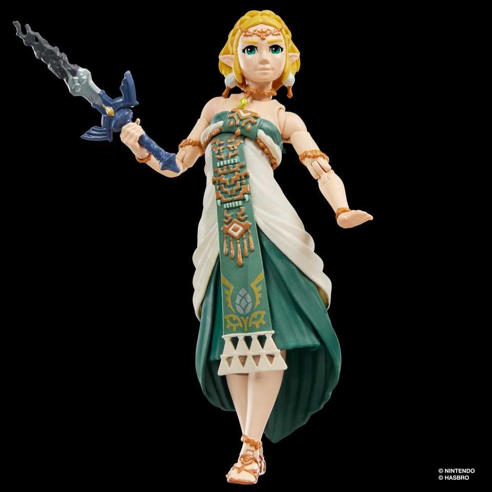 Zelda holding the broken Master Sword on a black background.