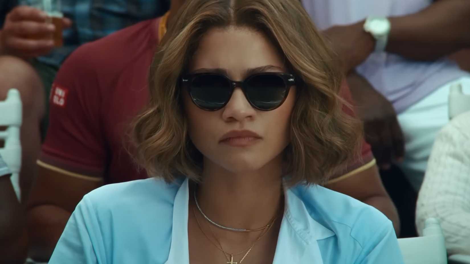 Zendaya looking serious wearing sunglasses in Challengers