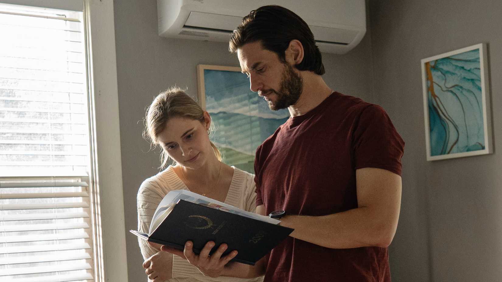 Ben Barnes’s Tim and Hannah Galway’s Wendy looking at a notebook in The Institute season 1