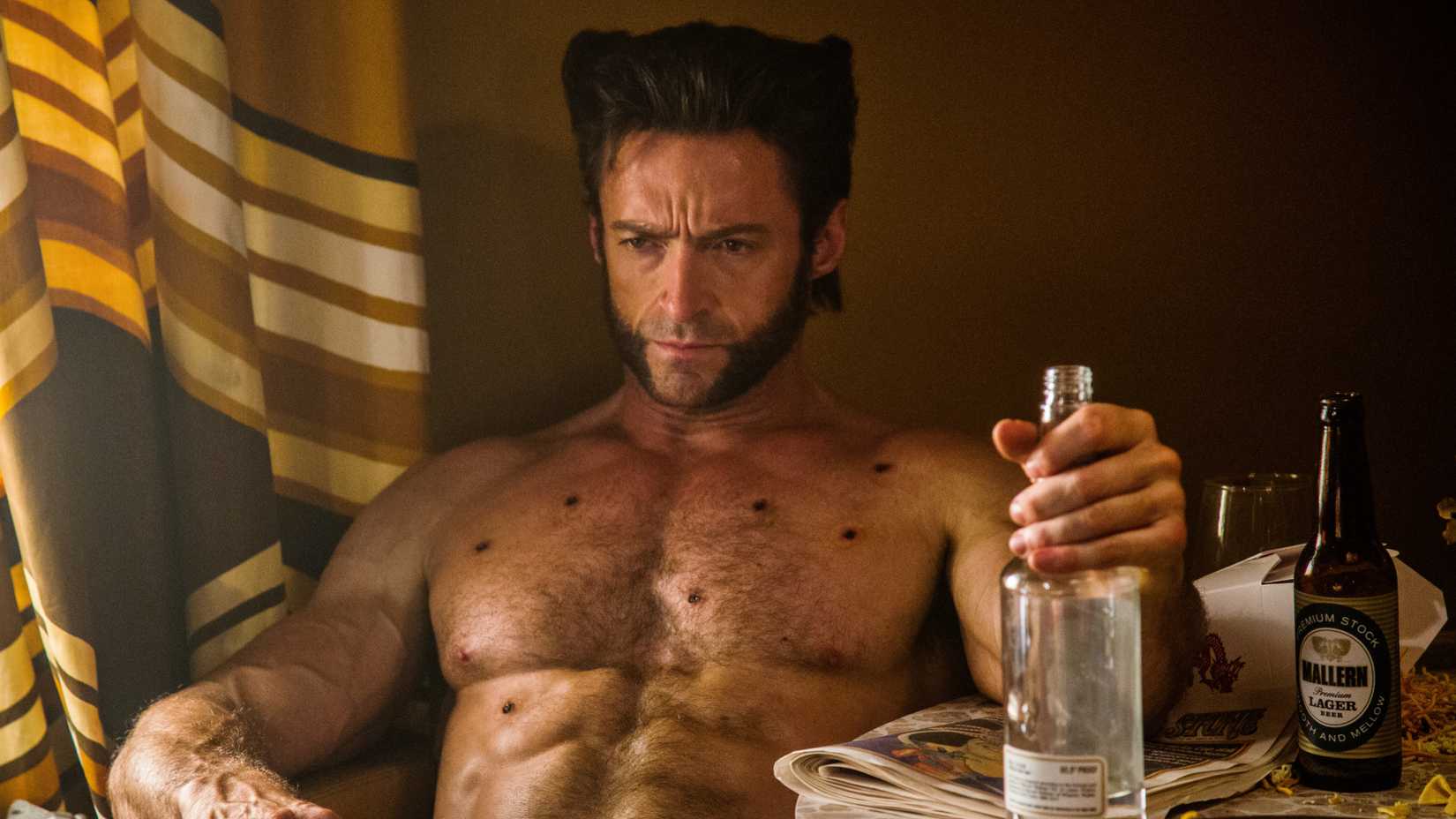 Hugh Jackman’s Wolverine sitting with bullet wounds in X-Men: Days of Future Past