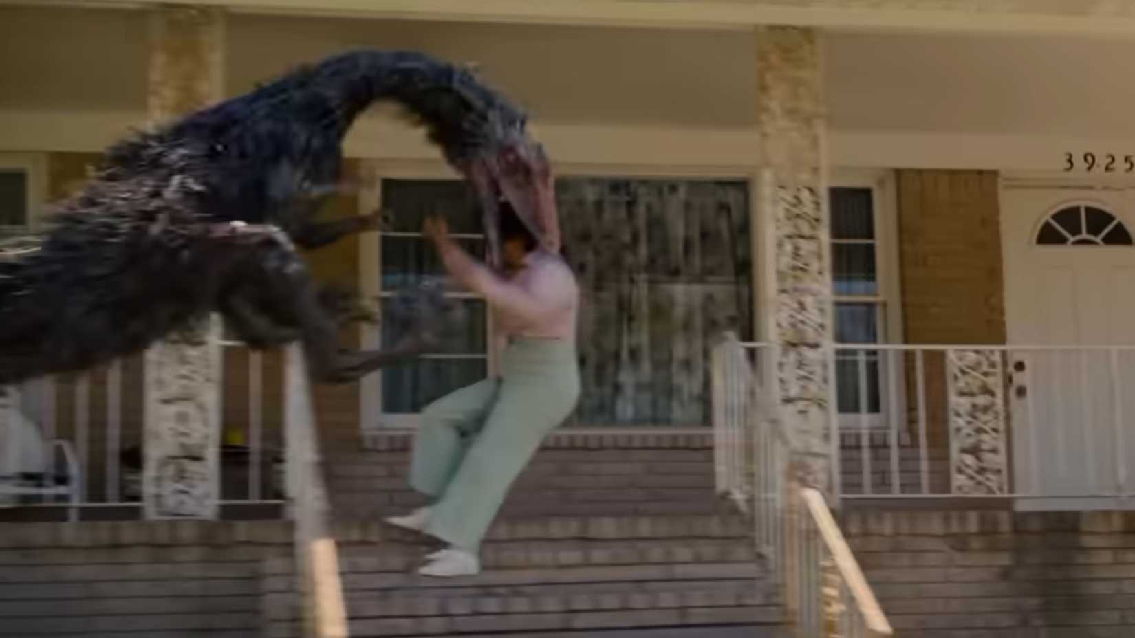 A dinosaur biting a womans head in the end of oak street