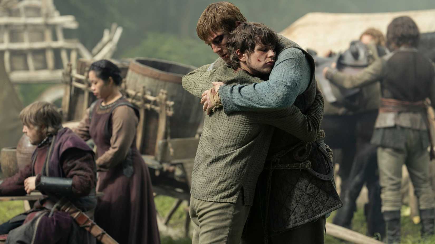 Dunk (Peter Claffey) hugging Raymun (Shaun Thomas) in A Knight of the Seven Kingdoms.