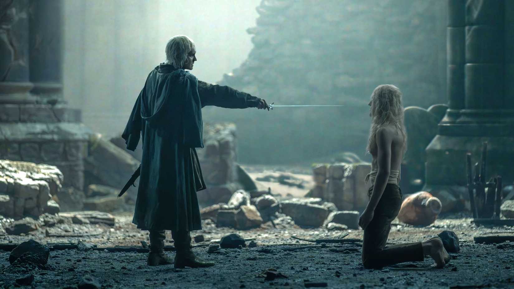 Aegon (Tom Glynn-Carney) points his sword at Aemond (Ewan Mitchell) kneeling in House of the Dragon season 3 finale