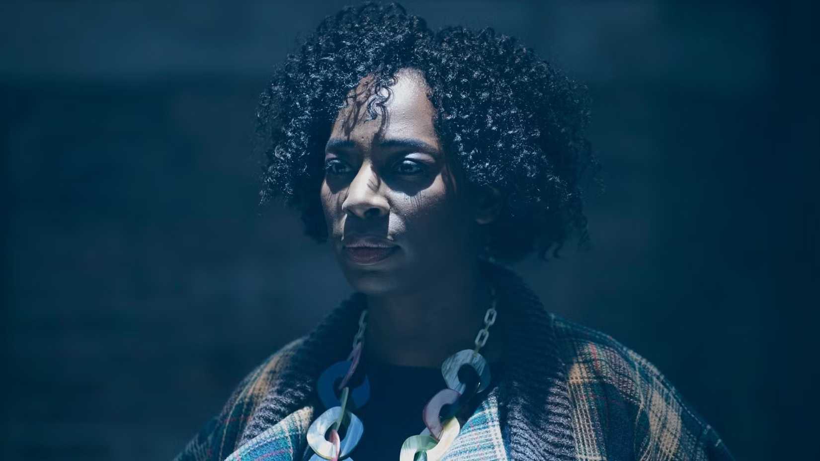 Agatha is in dim lighting in A Discovery of Witches