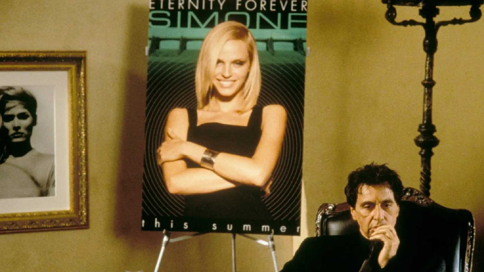 Al Pacino sits with a picutre of Simone behind him