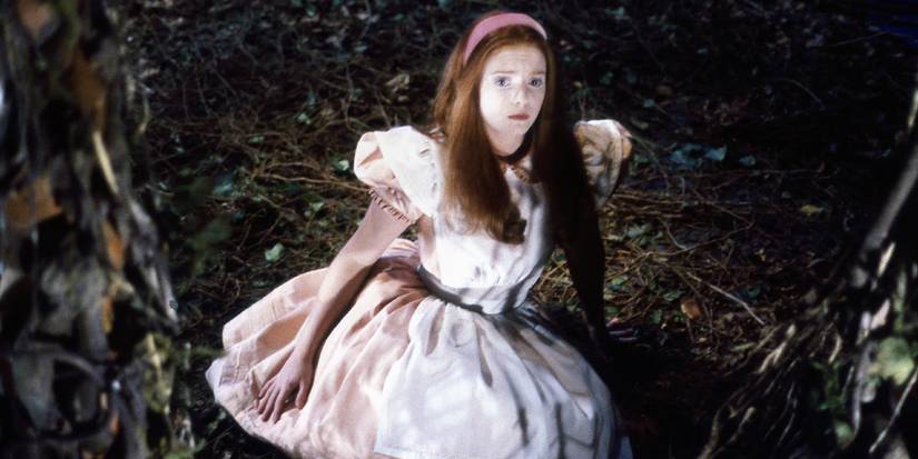 Alice falls on the forest floor in the BBC's 1986 Alice in Wonderland miniseries