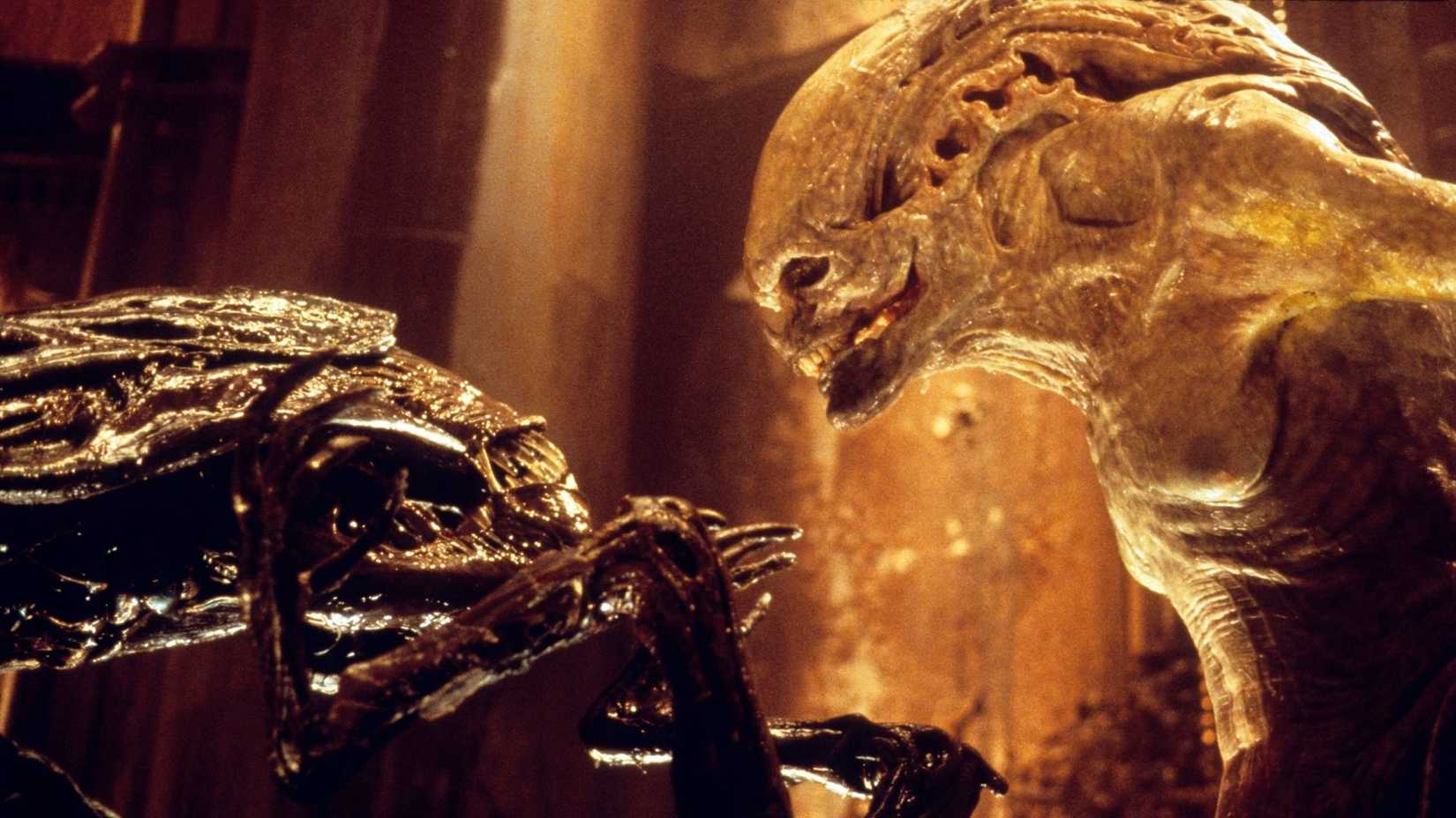 A Newborn staring down at a Xenomorph in Alien Resurrection.