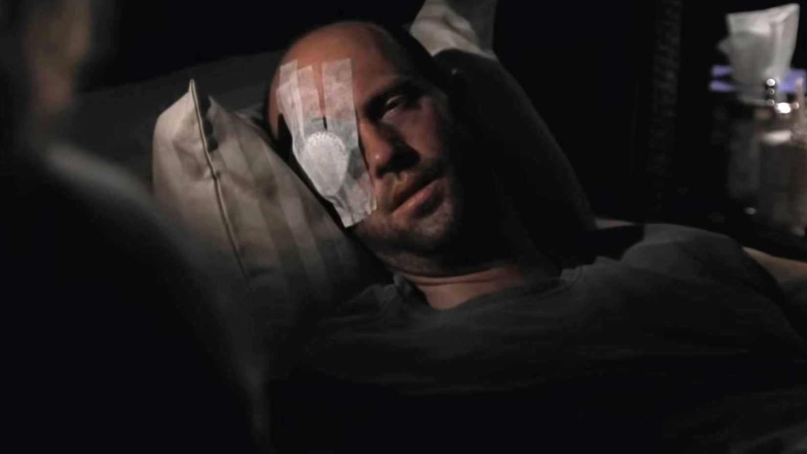 Anthony Edwards' Mark wearing his eye cover while in bed in ER season 8