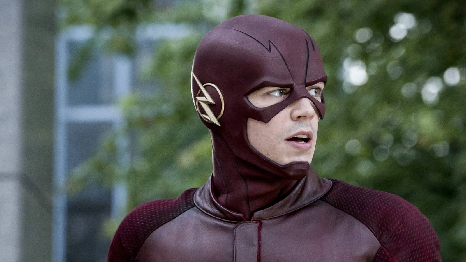 Barry Allen as The Flash looks shocked to the side in the CW's The Flash