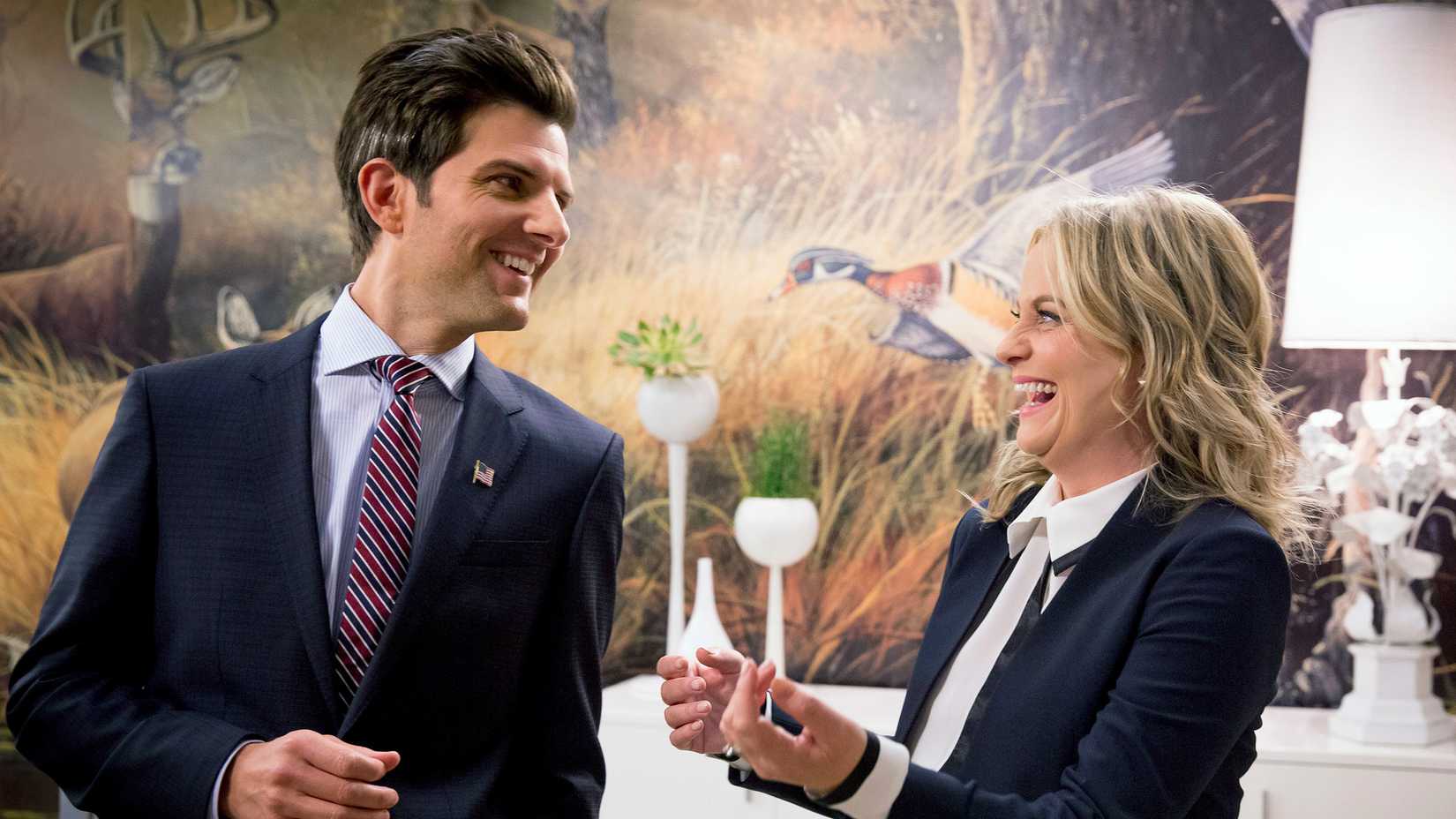 Ben and Leslie laughing together in Parks and Rec.