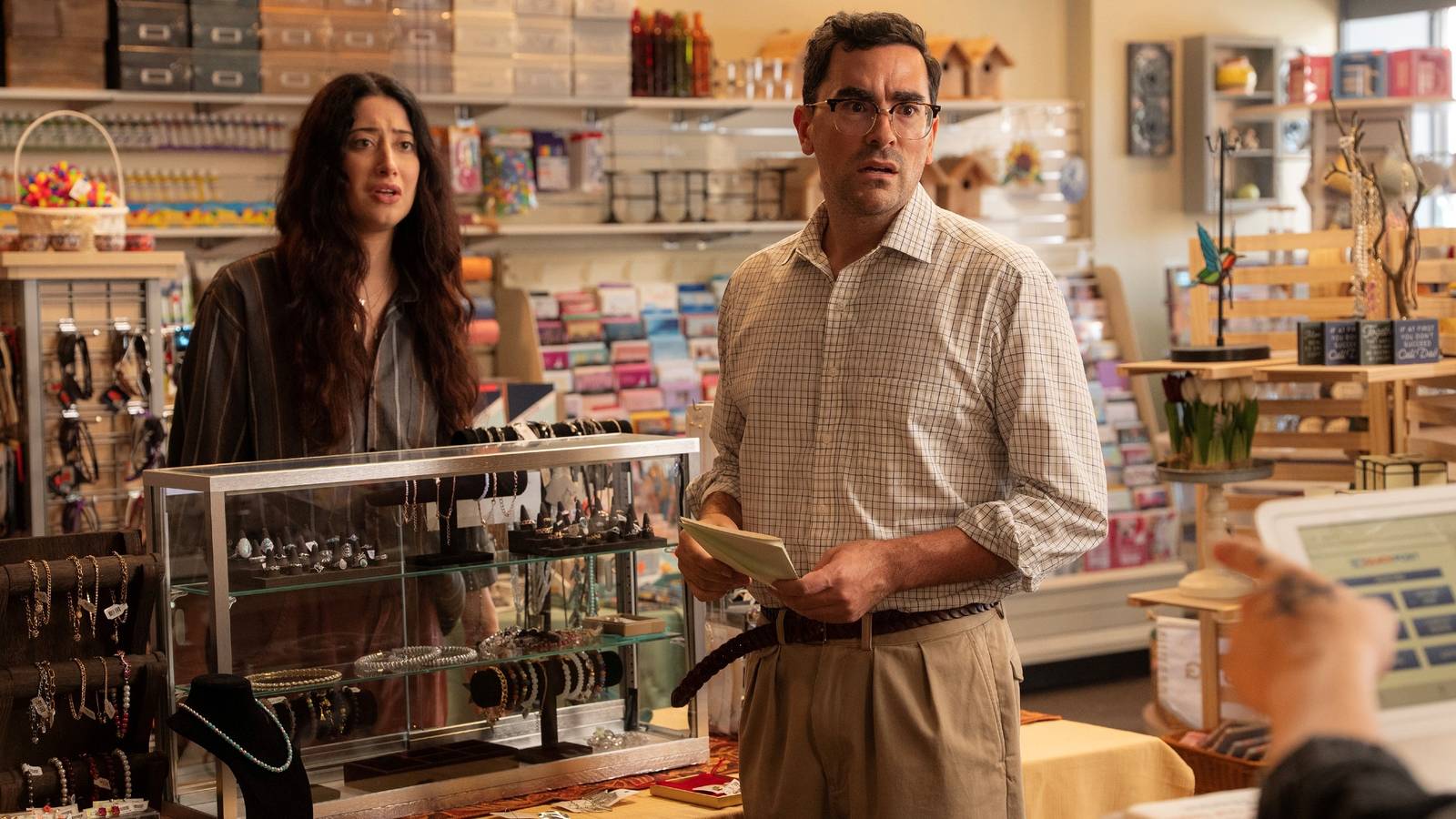 Still of Dan Levy and Taylor Ortega in Netflix's Big Mistakes season 1.
