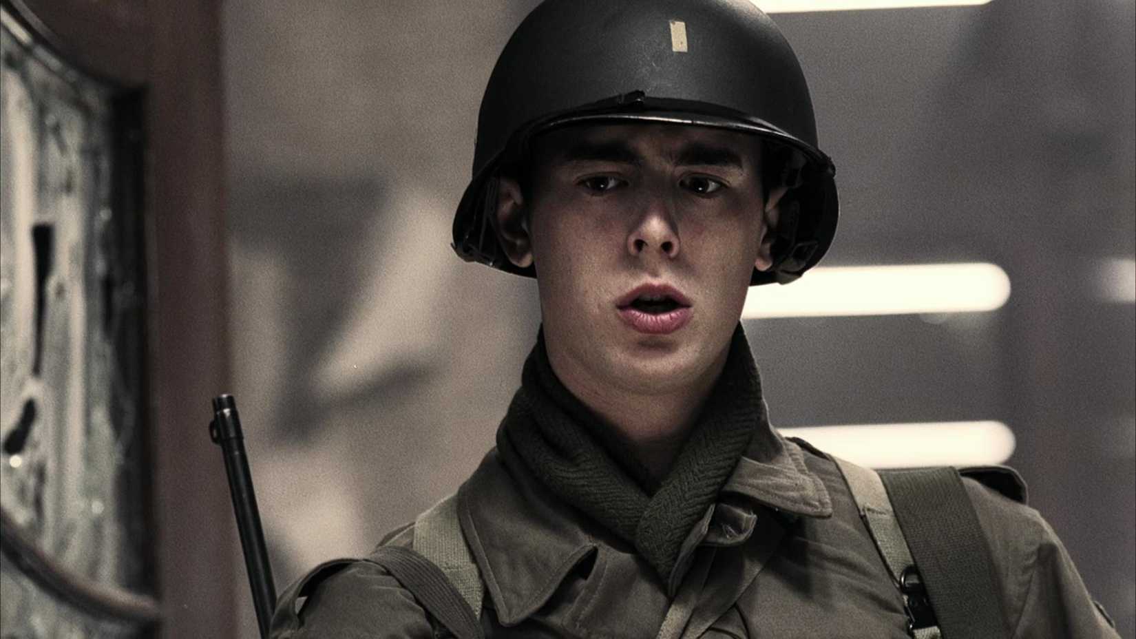 First Lieutenant Henry S. Jones wears a helmet and looks worried in Band of Brothers