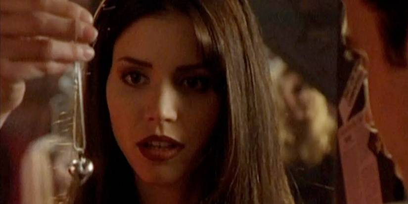Cordelia looking at a necklace in Buffy the Vampire Slayer