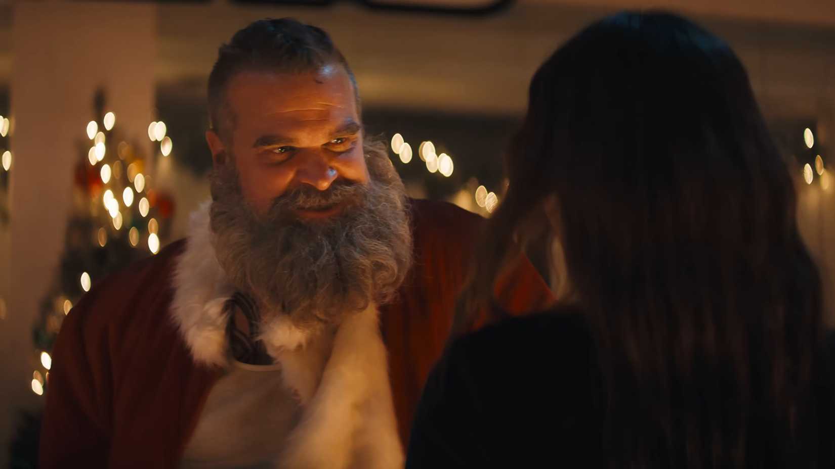 David Harbour's Santa smiling sweetly while talking to someone in Violent Night 2