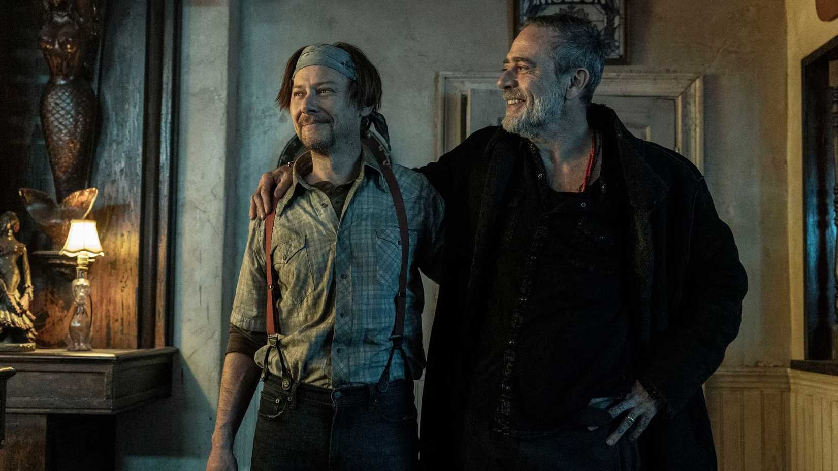 Dillard (Jimmi Simpson) and Negan (Jeffrey Dean Morgan) smiling together in The Walking Dead: Dead City