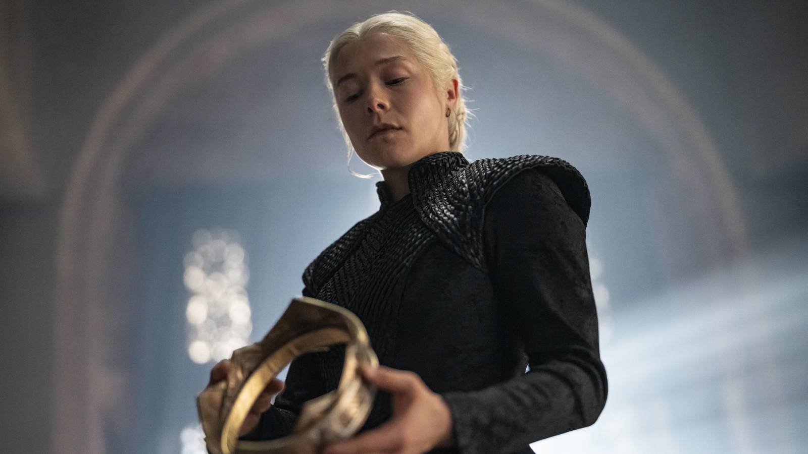 Emma D'Arcy as Queen Rhaenyra Targaryen in House of the Dragon season 3, holding a crown 