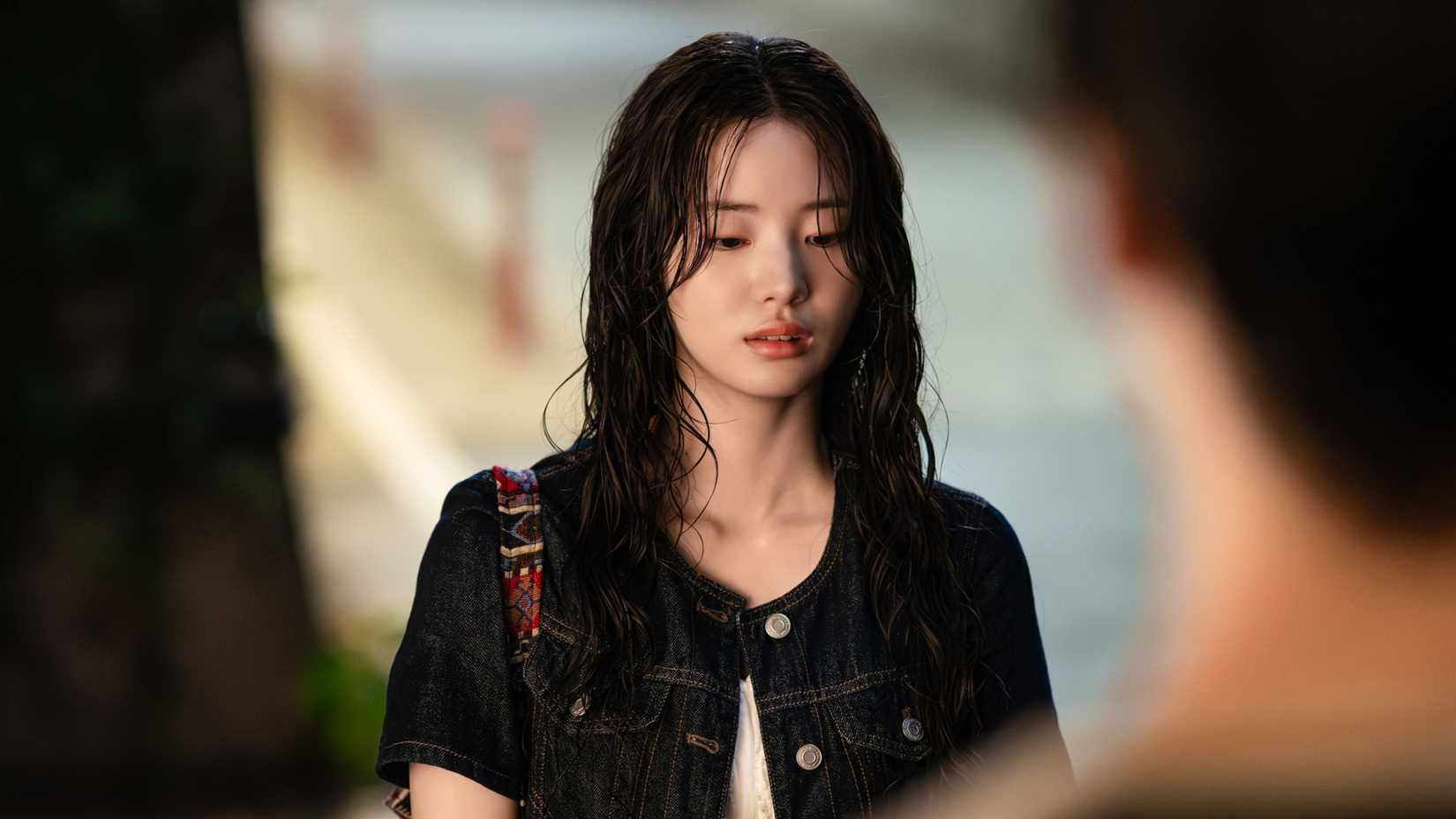 A girl stands in the rain in the 2025 remake of Even If This Love Disappears Tonight.
