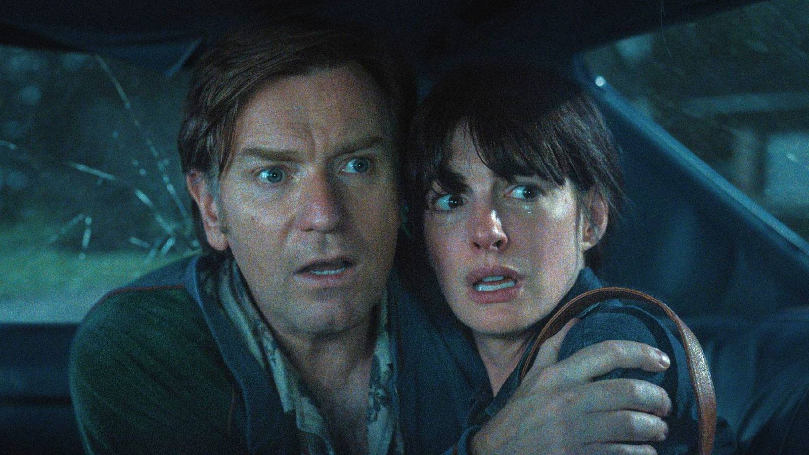 Ewan McGregor and Anne Hathaway looking scared in The End of Oak Street