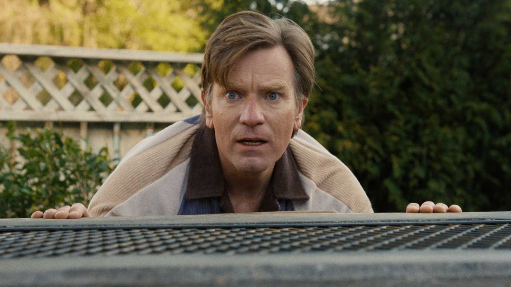 Ewan McGregor with a wide-eyed panicked expression in The End of Oak Street