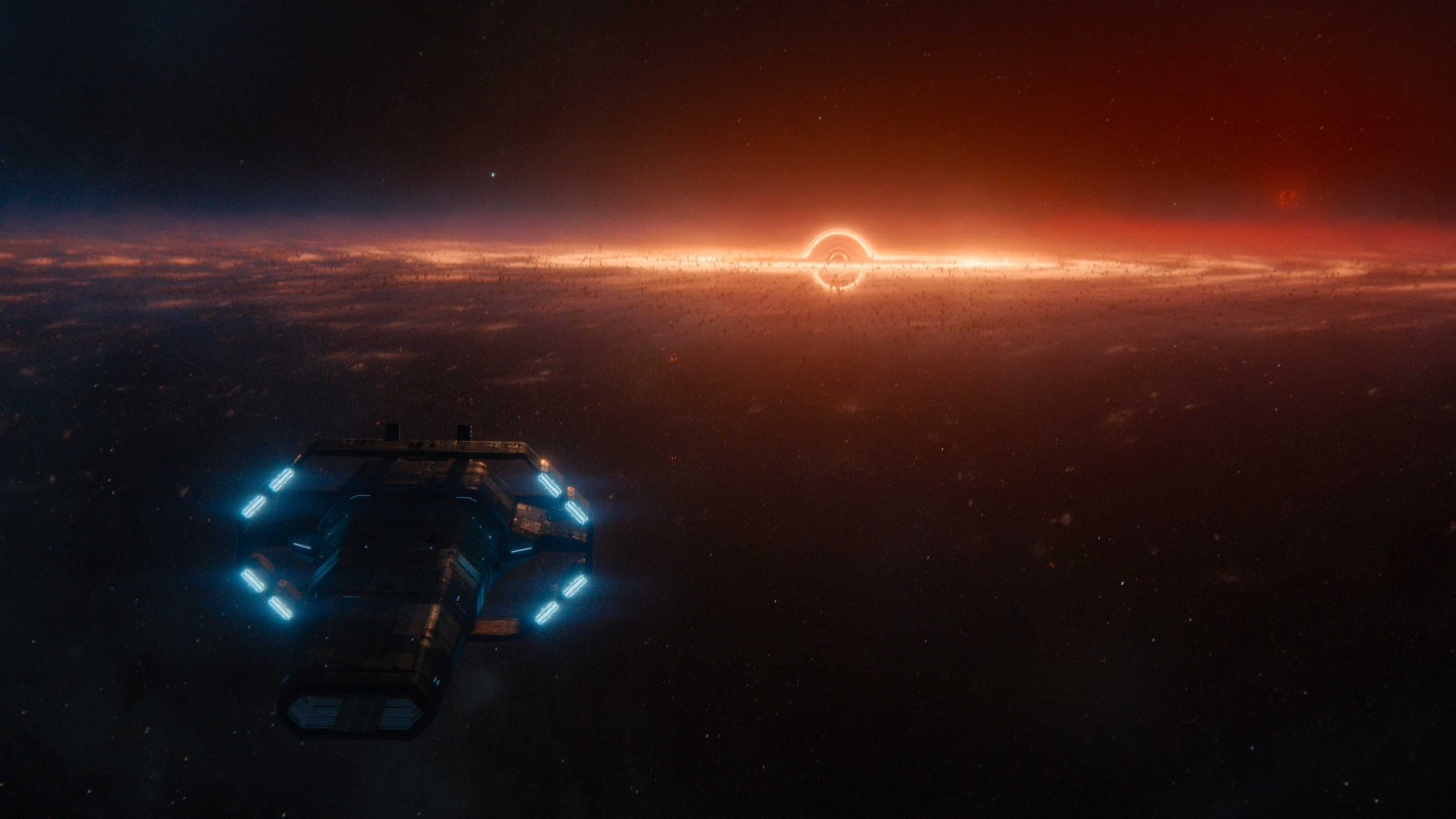 FOundation ship with red planet and rings in background