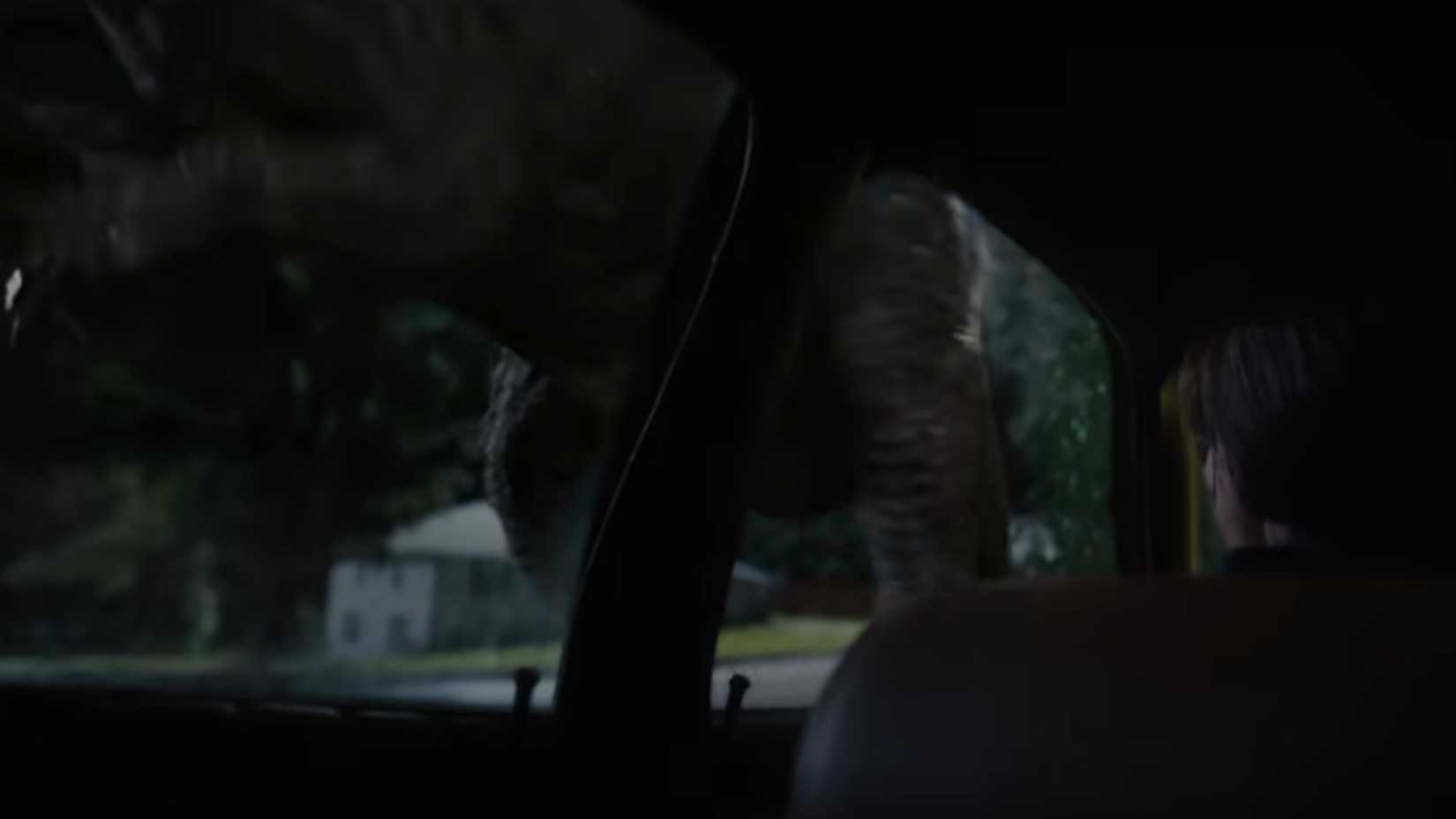 Greg Platt (Ewan Mcgregor) hiding from a spinosaurus in his car in the end of oak street