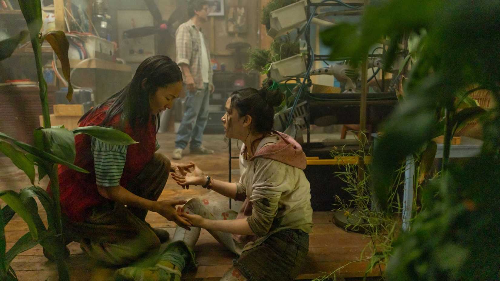 Greta Lee as Riley working with plants with Emma Ho as Ruth in The Last House