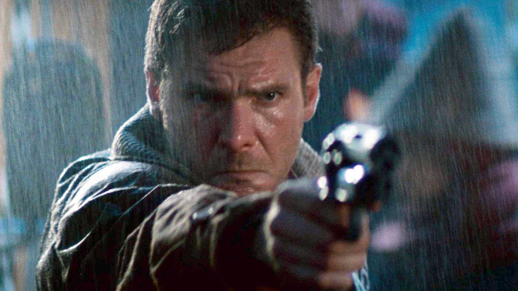 harrison ford's deckard pursues a replicant in ridely scott's blade runner