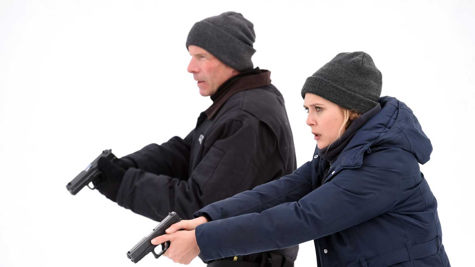 Hugh Dillion as Curtis with  Elizabeth Olsen as Jane Banner in Wind River