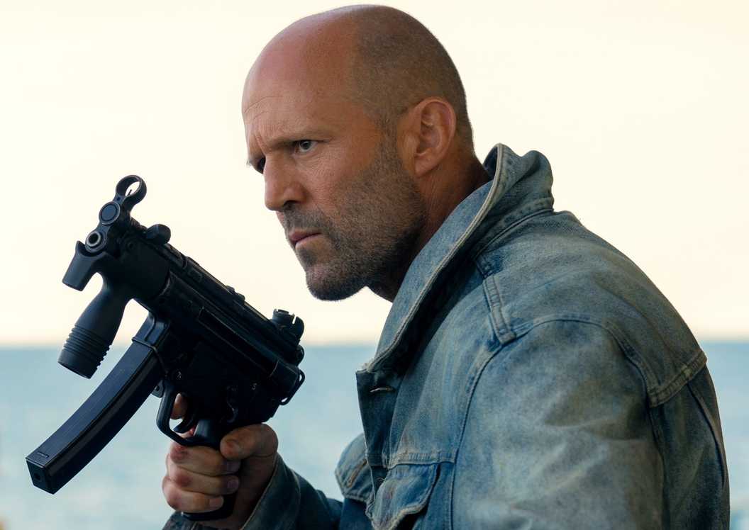 Jason Statham holding a gun in Mutiny