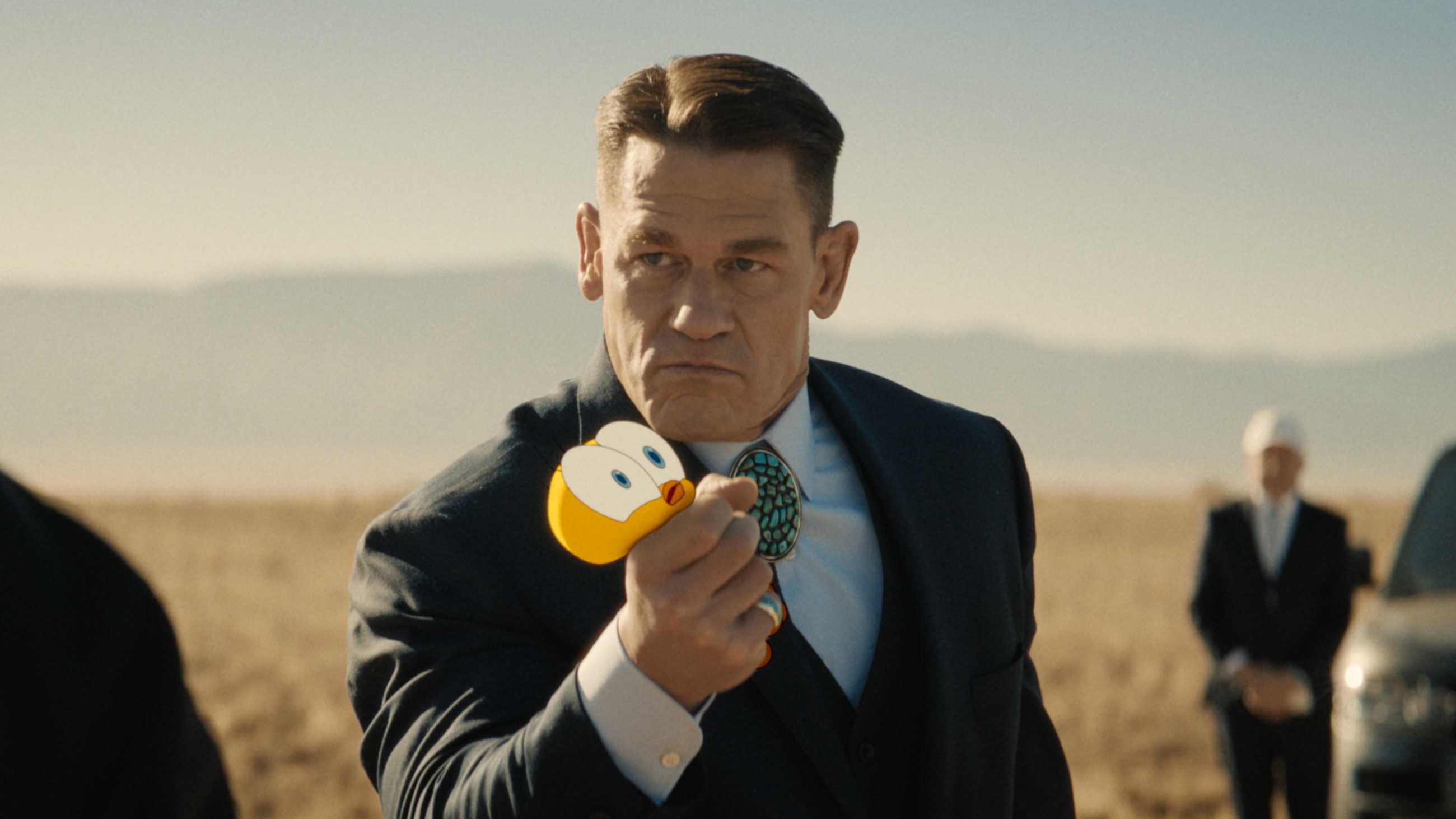 John Cena squeezing Tweety, whose eyes are popping out, in Coyote vs. Acme