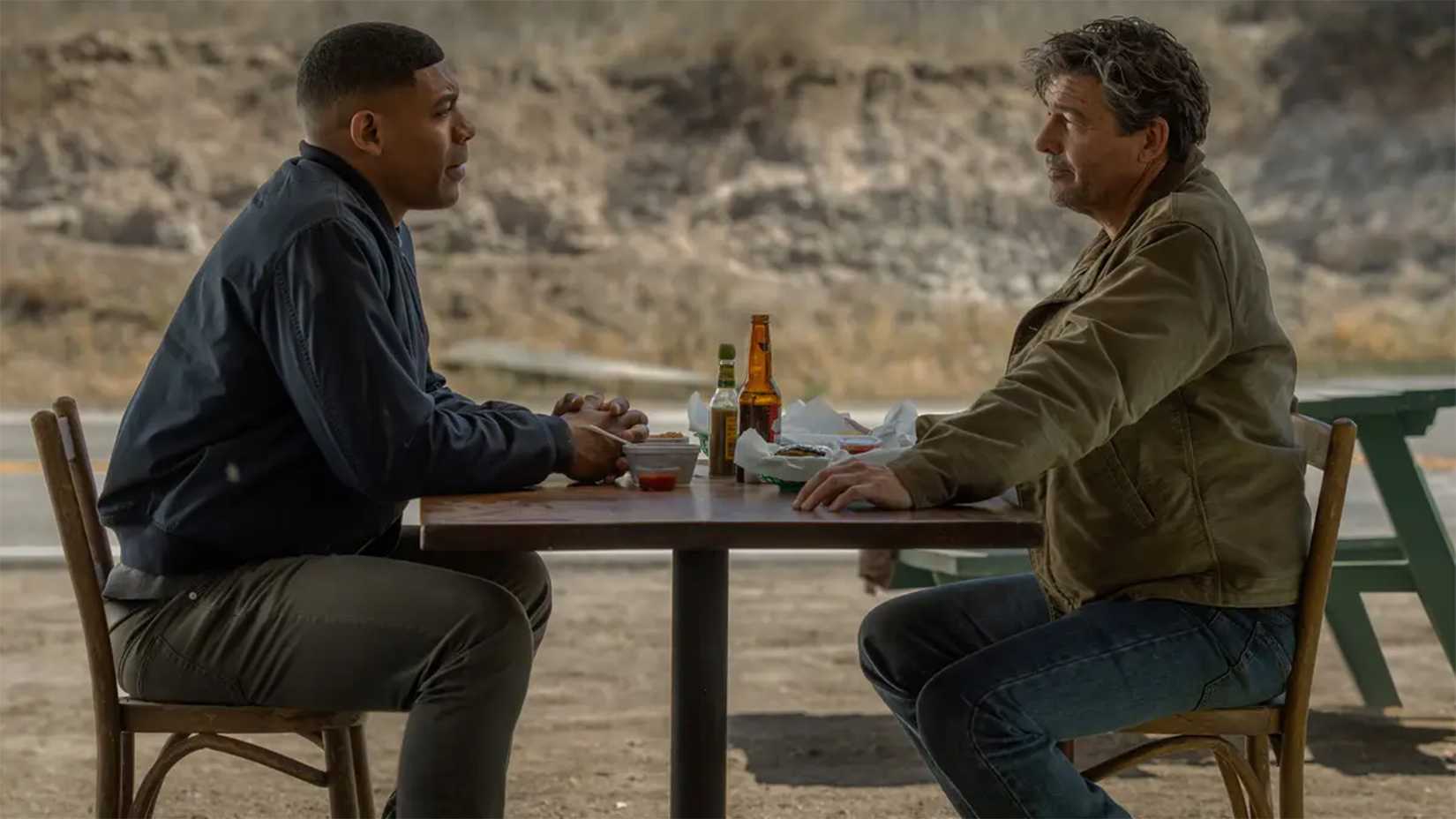 John Stewart and Hal Jordan at a table in Lanterns