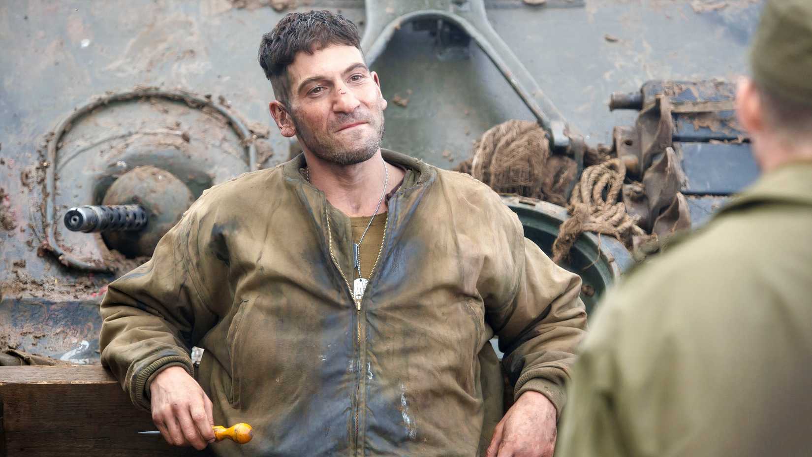 Jon Bernthal looking angry and leaning on a tank in Fury (2014)