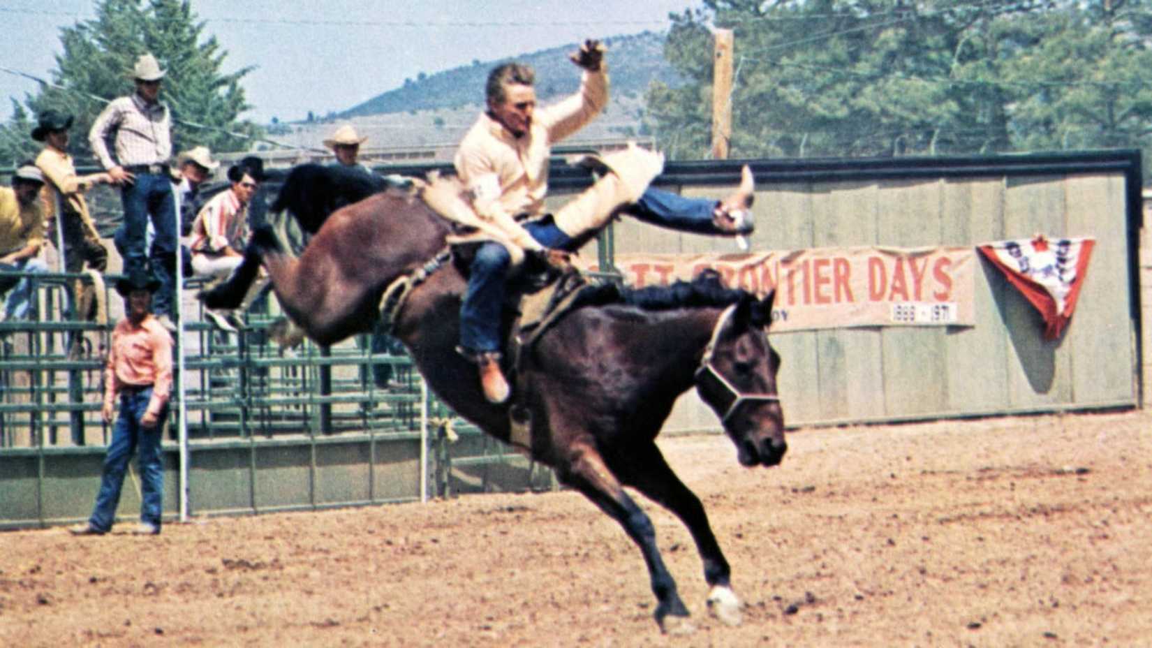 Junior rides a bucking bronco in Junior Bonner