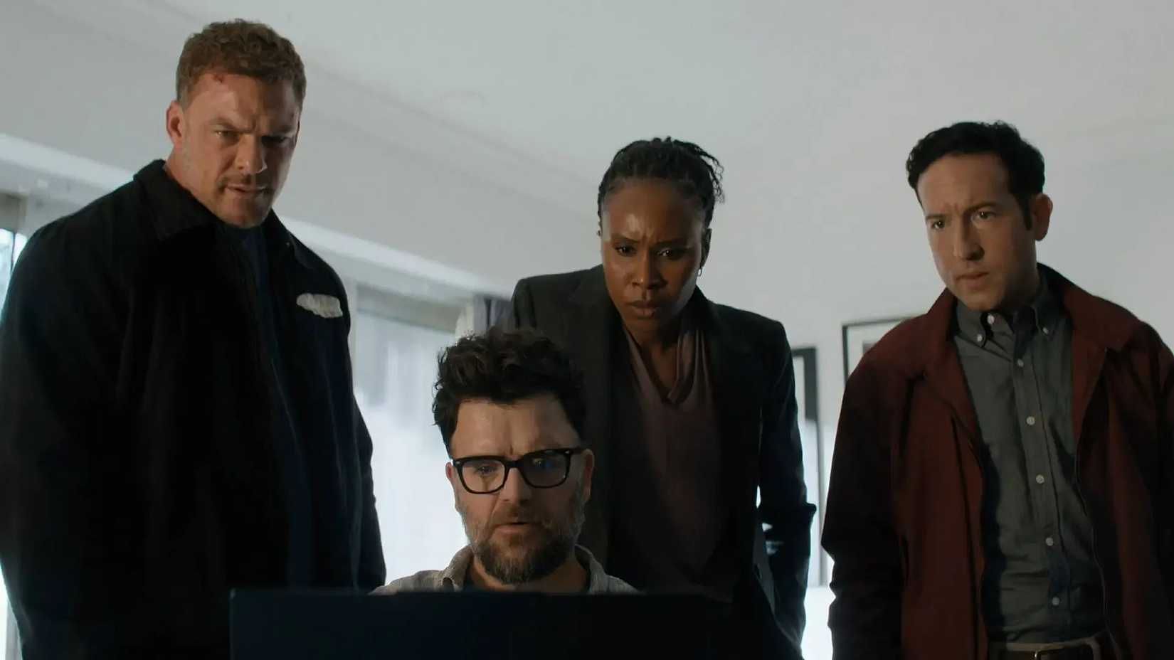 Reacher, Rusell, Jacob, and Tamara looking at a laptop screen