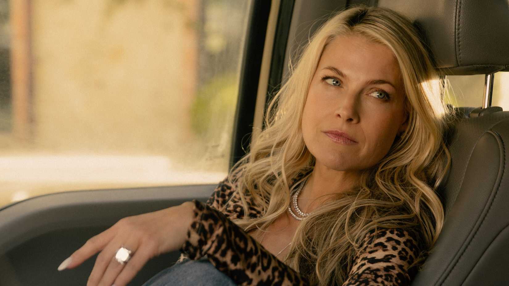 Angela Norris (Ali Larter) looking disappointed in a car in Landman season 1