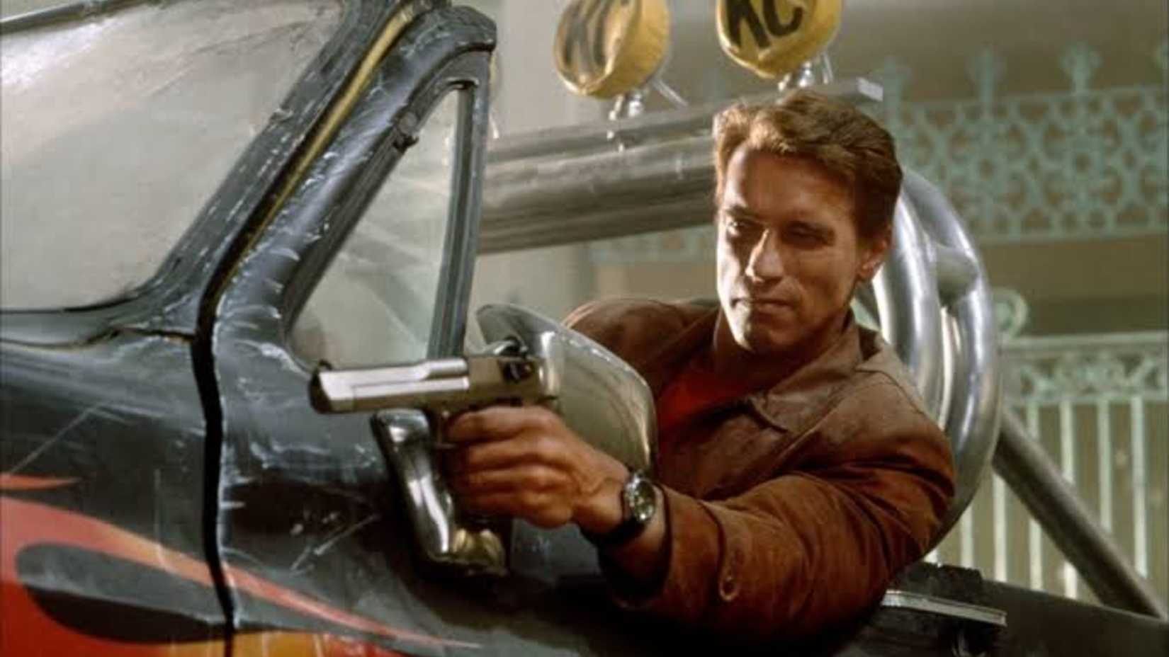 Schwarzenegger firing his gun in Last Action Hero