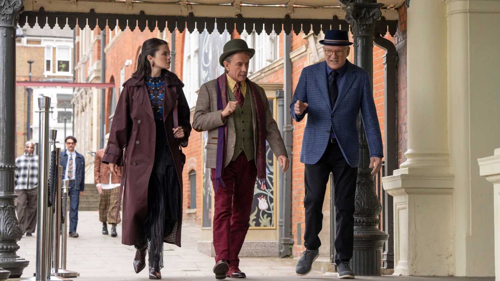 Mabel, Oliver, and Charles walking on a London street in Only Murders in the Building