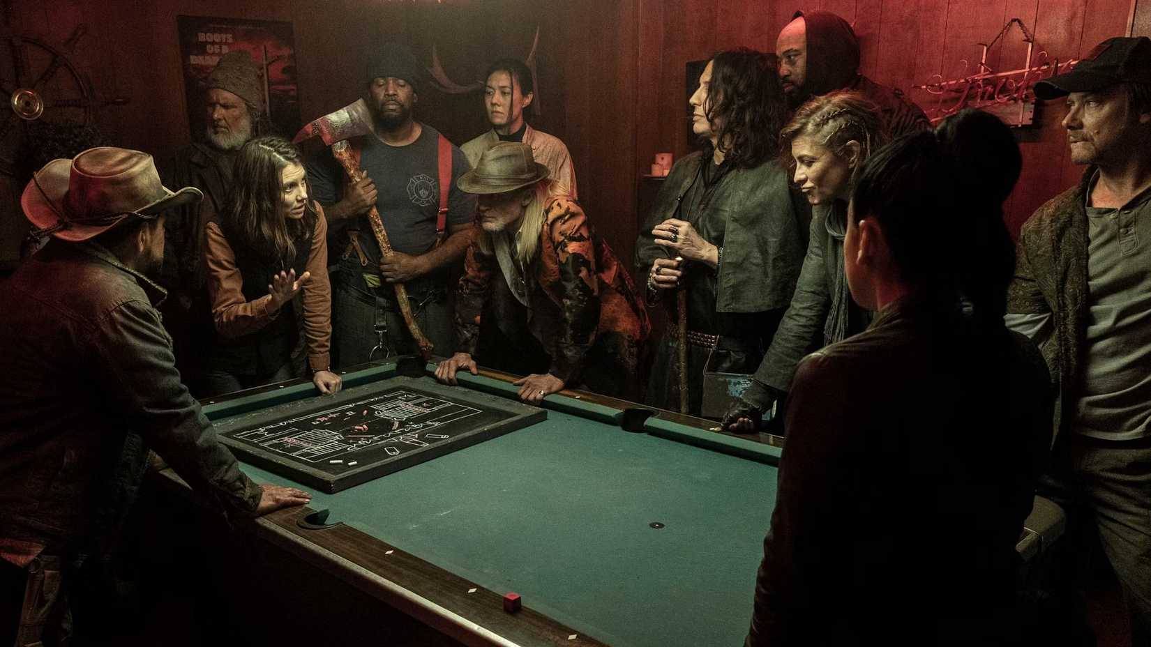 Maggie (Lauren Cohan) laying out her plan to other characters in The Walking Dead: Dead City