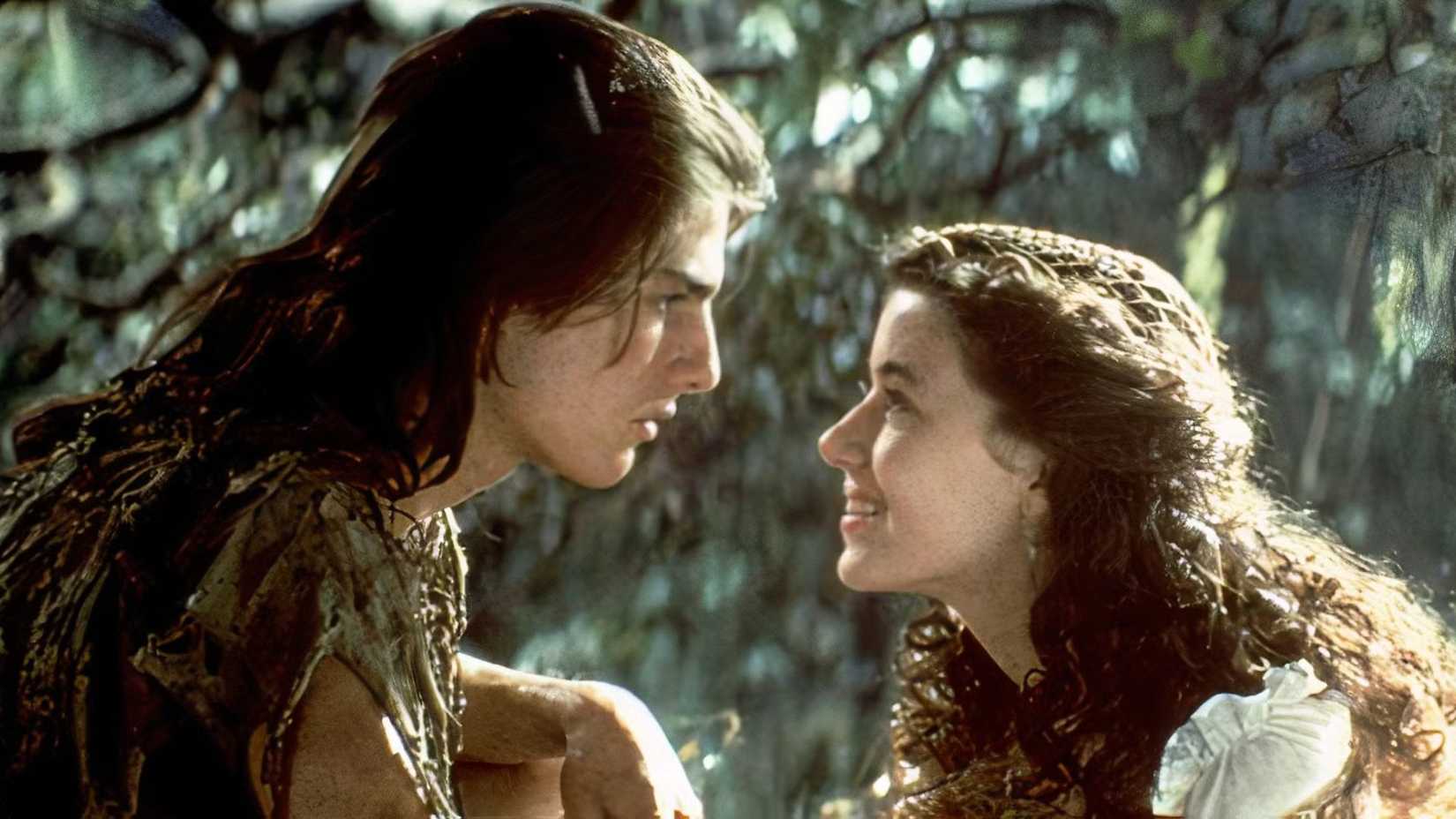 Mia Sara as Lili and Tom Cruise as Jack looking at each other intently in Legend