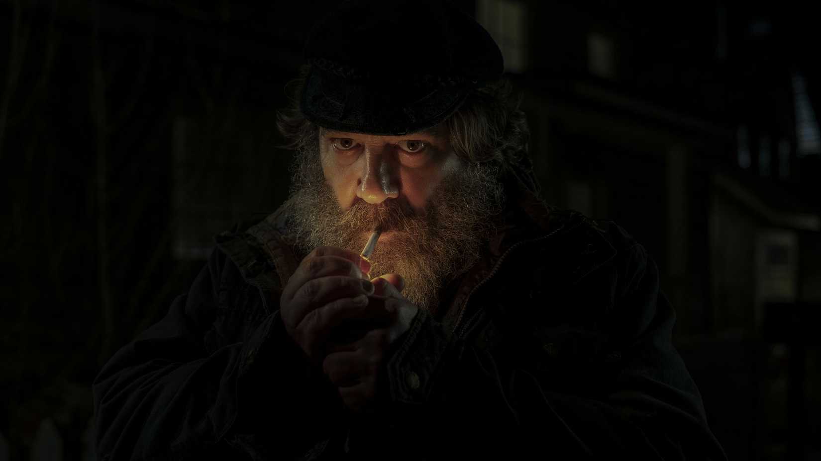 Robert Longstreet as Joe Collie lighting a cigarette in Midnight Mass.
