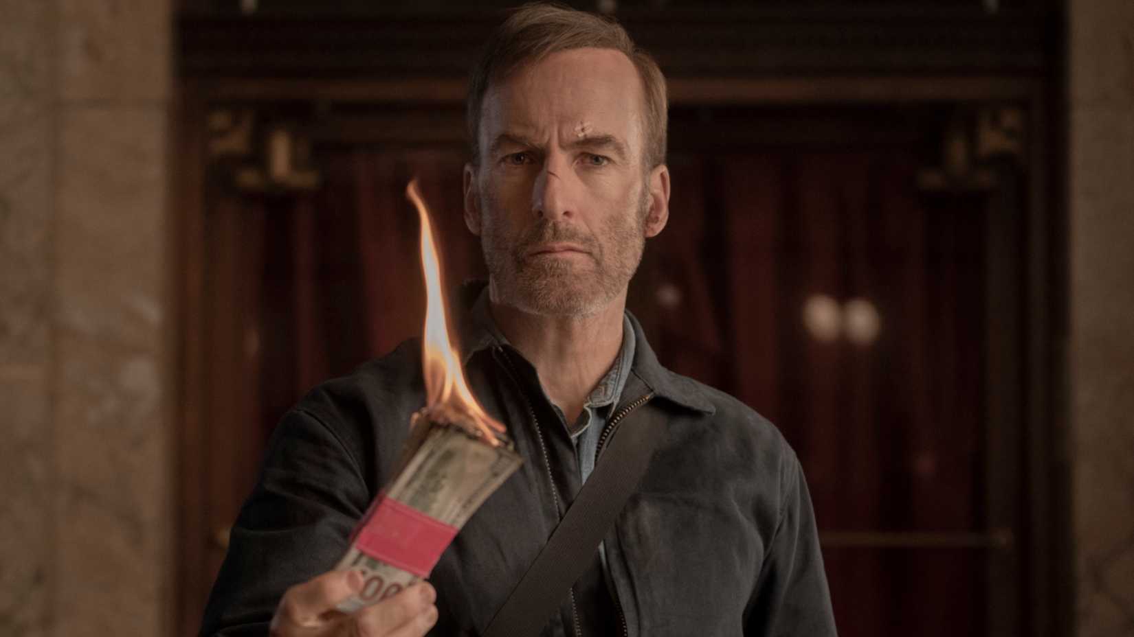 Bob Odenkirk burning money in Nobody