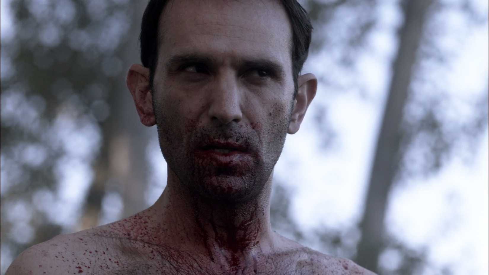 A white man wearing no shirt and splattered in blood from the series Supernatural