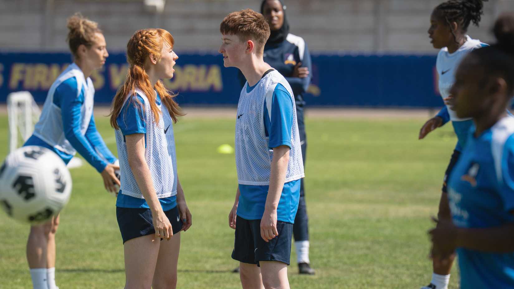 Niamh (Aisling Sharkey) yelling at Siobhan (Rex Hayes) on the pitch in Ted Lasso season 4