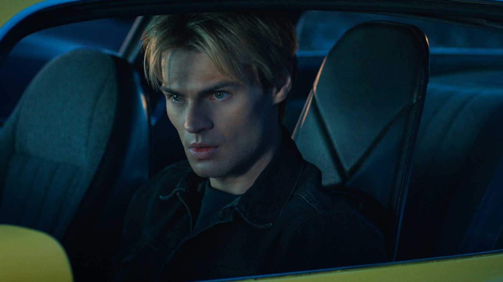 Noah LaLonde sitting in his racing car in My Life With The Walter Boys seaon 3