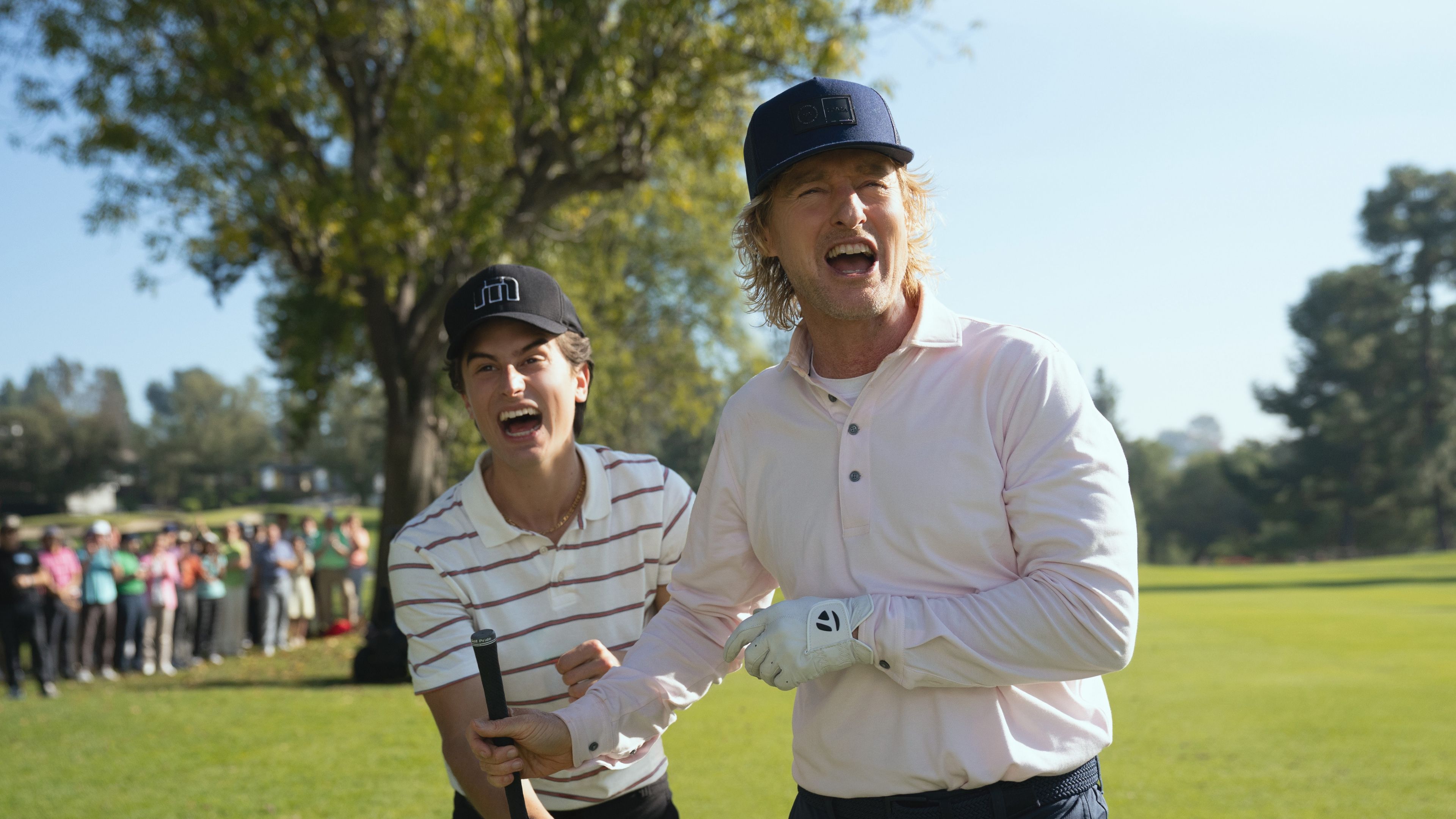peter-dager-and-owen-wilson-on-the-course-in-stick-season-2 Timothy Olyphant's Hit 10-Part Apple TV Series Keeps Getting Better Ahead Of 2026 Return